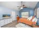 Bright bedroom with a vaulted ceiling, ceiling fan, a comfortable queen bed, and a TV on the dresser at 247 Darcy Ave, Goose Creek, SC 29445