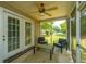 Inviting screened porch with neutral furniture and ceiling fan for comfortable outdoor relaxation at 247 Darcy Ave, Goose Creek, SC 29445