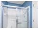 Modern shower with sliding glass doors and white tiled walls, offering a clean and bright space at 247 Darcy Ave, Goose Creek, SC 29445