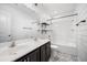 Stylish bathroom featuring a dual sink vanity, modern mirrors, shiplap wall, and a shower-tub combo at 259 Weeping Cypress Dr, Moncks Corner, SC 29461