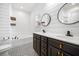 Well-lit bathroom featuring a dual sink vanity, stylish mirrors, shiplap, and unique tile flooring at 259 Weeping Cypress Dr, Moncks Corner, SC 29461