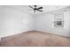 Cozy bedroom with neutral carpet, closet, and a window, offering a comfortable living space at 259 Weeping Cypress Dr, Moncks Corner, SC 29461