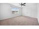 Spacious bedroom with neutral carpet, closet, and a window with ample natural light at 259 Weeping Cypress Dr, Moncks Corner, SC 29461
