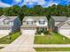 View of a two-story home with an attached garage and well-maintained landscaping at 259 Weeping Cypress Dr, Moncks Corner, SC 29461