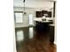 Open kitchen featuring dark wood cabinets, stainless appliances, and a large island with barstool seating at 259 Weeping Cypress Dr, Moncks Corner, SC 29461