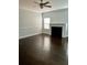 Inviting living room features a classic fireplace, neutral paint, and hardwood flooring at 259 Weeping Cypress Dr, Moncks Corner, SC 29461