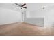 Open loft space with neutral carpet, ceiling fan, and bright natural light, perfect for versatile use at 259 Weeping Cypress Dr, Moncks Corner, SC 29461