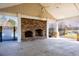Outdoor covered patio with brick fireplace overlooking community pool and serene lake views at 259 Weeping Cypress Dr, Moncks Corner, SC 29461