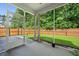 Cozy screened porch with outdoor views of the lawn and privacy fence, offering a relaxing space at 259 Weeping Cypress Dr, Moncks Corner, SC 29461