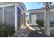 Exterior back porch and side door with gray siding and concrete pavers at 2909 Swamp Sparrow Cir, Johns Island, SC 29455