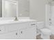 Bright bathroom with a white vanity, toilet, and shower with fresh, clean decor at 2909 Swamp Sparrow Cir, Johns Island, SC 29455
