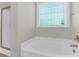 Clean bathroom with tub and shower combination featuring a modern design at 2909 Swamp Sparrow Cir, Johns Island, SC 29455