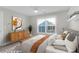 This bedroom showcases a well-lit space with a large window and stylish furnishings at 2909 Swamp Sparrow Cir, Johns Island, SC 29455