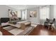 Bright bedroom with modern decor, featuring a large bed and a cozy seating area at 2909 Swamp Sparrow Cir, Johns Island, SC 29455