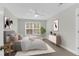 This cozy bedroom features neutral tones, stylish decor, and a bright window for natural light at 2909 Swamp Sparrow Cir, Johns Island, SC 29455