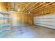 Spacious garage with unfinished walls, shelving, and an open garage door providing ample storage at 2909 Swamp Sparrow Cir, Johns Island, SC 29455