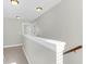 Upstairs hallway featuring neutral decor and clear sight lines into other rooms at 2909 Swamp Sparrow Cir, Johns Island, SC 29455