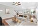 Spacious and modern living room with an open-concept design, hardwood floors and an abundance of natural light at 2909 Swamp Sparrow Cir, Johns Island, SC 29455