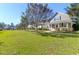 Attractive street view with colorful homes, lush lawn, and shade trees enhancing the neighborhood charm at 2909 Swamp Sparrow Cir, Johns Island, SC 29455