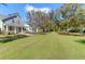 Charming gray home with a well-manicured lawn and mature trees providing shade and curb appeal at 2909 Swamp Sparrow Cir, Johns Island, SC 29455
