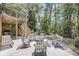 Backyard patio area with comfortable seating, a fire pit, and a built-in grill, perfect for entertaining at 2919 Zachary George Ln, Johns Island, SC 29455