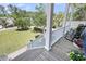 Cozy porch with rocking chairs overlooking a well-manicured lawn at 2919 Zachary George Ln, Johns Island, SC 29455