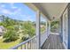 Picturesque view from the porch with lush greenery and neighborhood homes at 2919 Zachary George Ln, Johns Island, SC 29455