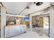 Finished basement with concrete walls and floor, work tables, TV, sink, refrigerator, and exterior access at 2919 Zachary George Ln, Johns Island, SC 29455