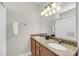 Bathroom featuring a granite-topped double vanity, decorative lighting, and a large mirror at 2919 Zachary George Ln, Johns Island, SC 29455