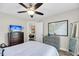Bedroom with a TV, dresser, mirror, ceiling fan, carpet, and white comforter at 2919 Zachary George Ln, Johns Island, SC 29455