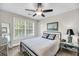 Bedroom with a bed, bedside table, large window, a mirror, and unique furniture at 2919 Zachary George Ln, Johns Island, SC 29455