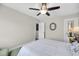Bedroom with a bed, ceiling fan, carpet, and an ensuite bathroom with a mirrored wall at 2919 Zachary George Ln, Johns Island, SC 29455
