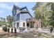 Exterior of a two-story home featuring a patio area, second floor deck and manicured landscaping at 2919 Zachary George Ln, Johns Island, SC 29455