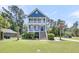 Charming blue two-story home with double front porches and manicured landscaping at 2919 Zachary George Ln, Johns Island, SC 29455
