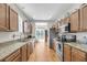 Well-lit kitchen featuring stainless steel appliances, granite countertops, and hardwood floors at 2919 Zachary George Ln, Johns Island, SC 29455