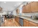 Spacious kitchen featuring stainless appliances flows into a dining and living area at 2919 Zachary George Ln, Johns Island, SC 29455