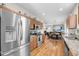 Open kitchen with stainless appliances flows into a dining area and living room with a TV at 2919 Zachary George Ln, Johns Island, SC 29455