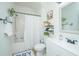 Bright bathroom features a shower/tub combo, vanity, a large mirror and decor at 2954 Woodland Park Dr, Mount Pleasant, SC 29466