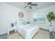 Cozy bedroom with a queen-sized bed, stylish decor, ceiling fan, and a bright window with a view at 2954 Woodland Park Dr, Mount Pleasant, SC 29466