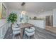 Cozy dining area with wood table, chairs, and open to kitchen with stainless appliances and countertops at 2954 Woodland Park Dr, Mount Pleasant, SC 29466