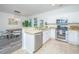 Well-lit kitchen with stainless steel appliances, countertops, and adjacent dining area at 2954 Woodland Park Dr, Mount Pleasant, SC 29466