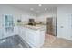 Bright kitchen featuring stainless steel appliances, tile floors, a breakfast bar and access to the deck at 2954 Woodland Park Dr, Mount Pleasant, SC 29466