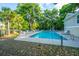 Inviting outdoor pool surrounded by trees and lounge chairs at 2954 Woodland Park Dr, Mount Pleasant, SC 29466