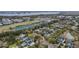 An aerial view showcases the homes nestled among lush greenery near the tranquil waters, with community amenities nearby at 303 S Ladd Ct, Charleston, SC 29492