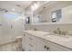 Luxurious bathroom features a double vanity with marble countertops, modern fixtures, and a glass-enclosed shower at 303 S Ladd Ct, Charleston, SC 29492