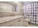 Bathroom with a marble countertop vanity, a shower with a patterned curtain and toilet at 303 S Ladd Ct, Charleston, SC 29492