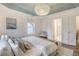 Luxurious bedroom featuring a tray ceiling with light and neutral decor at 303 S Ladd Ct, Charleston, SC 29492