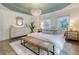 Bright bedroom featuring large windows, light wood furniture, and a patterned rug at 303 S Ladd Ct, Charleston, SC 29492