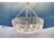 Close-up of a beaded chandelier with blue toned ceiling at 303 S Ladd Ct, Charleston, SC 29492