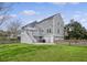 Exterior view of a beautiful home with a spacious backyard, deck, and patio area for outdoor living at 303 S Ladd Ct, Charleston, SC 29492